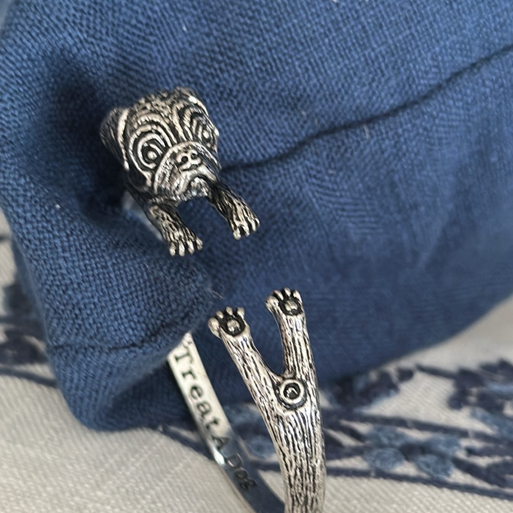 Treat a Dog Live Love Bark cuff looks like a pug silver tone metal inscribed
